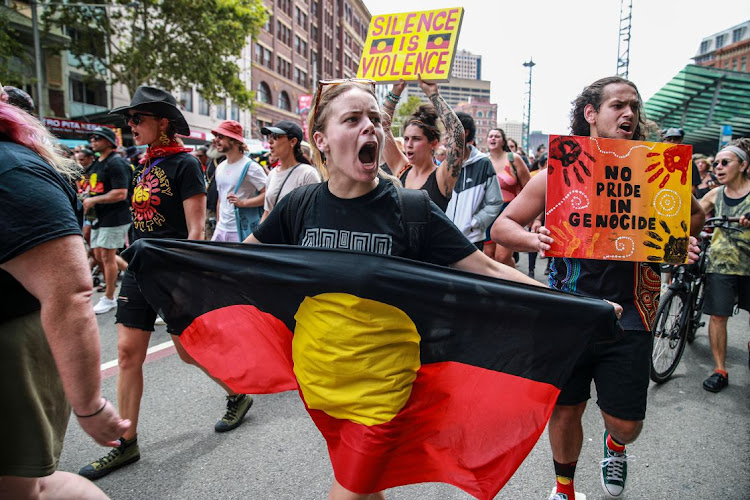 Demonstrators shout slogan as they march towards Victoria Park during an Invasion Day protest on January 26 2024 in Sydney, Australia. Picture: GETTY IMAGES/RONI BINTANG