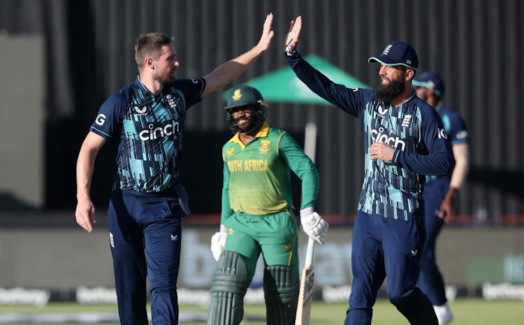 England's Chris Woakes celebrates taking the wicket of South Africa skipper Temba Bavuma with Moeen Ali at the De Beers Diamond Oval in Kimberley, February 1 2023. Picture: ROGAN WARD/REUTERS