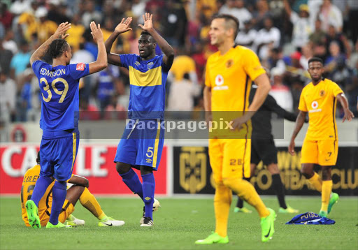 Cape Town City players Edmilson Dove and Joseph Adjei (L) celebrate victory as Kaizer Chiefs players look on in dejection after the Absa Premiership game at Cape Town Stadium on 25 April 2017. City won 3-2. © Ryan Wilkisky/BackpagePix