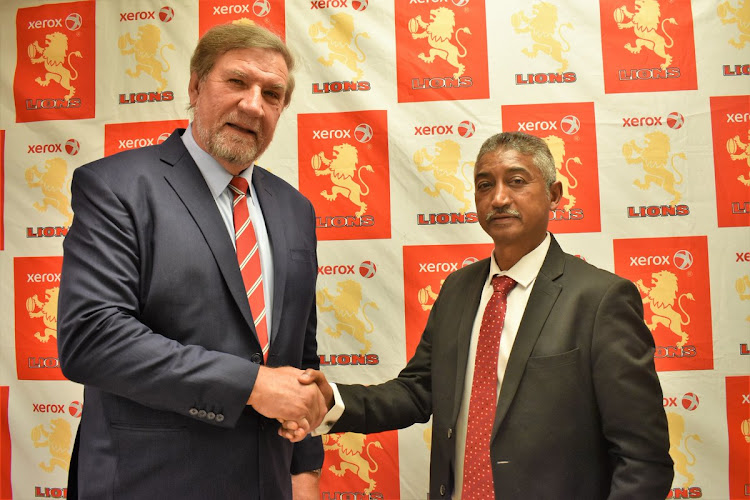 New Golden Lions president Neville Jardine (R) is congratulated by his predecessor Kevin de Klerk (L) on Monday September 17 2018.