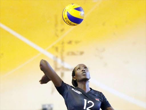 Lydia Maiyo of Kenya serves during their Zone 5 All Africa Games Qualifiers Women’s Volleyball Championships match against Burundi at Lugogo Indoor Arena in Kampala on April 24, 2015. Kenya won 3-0. Photo/Stephen Mudiari/www.pic-centre.com. (UGANDA)