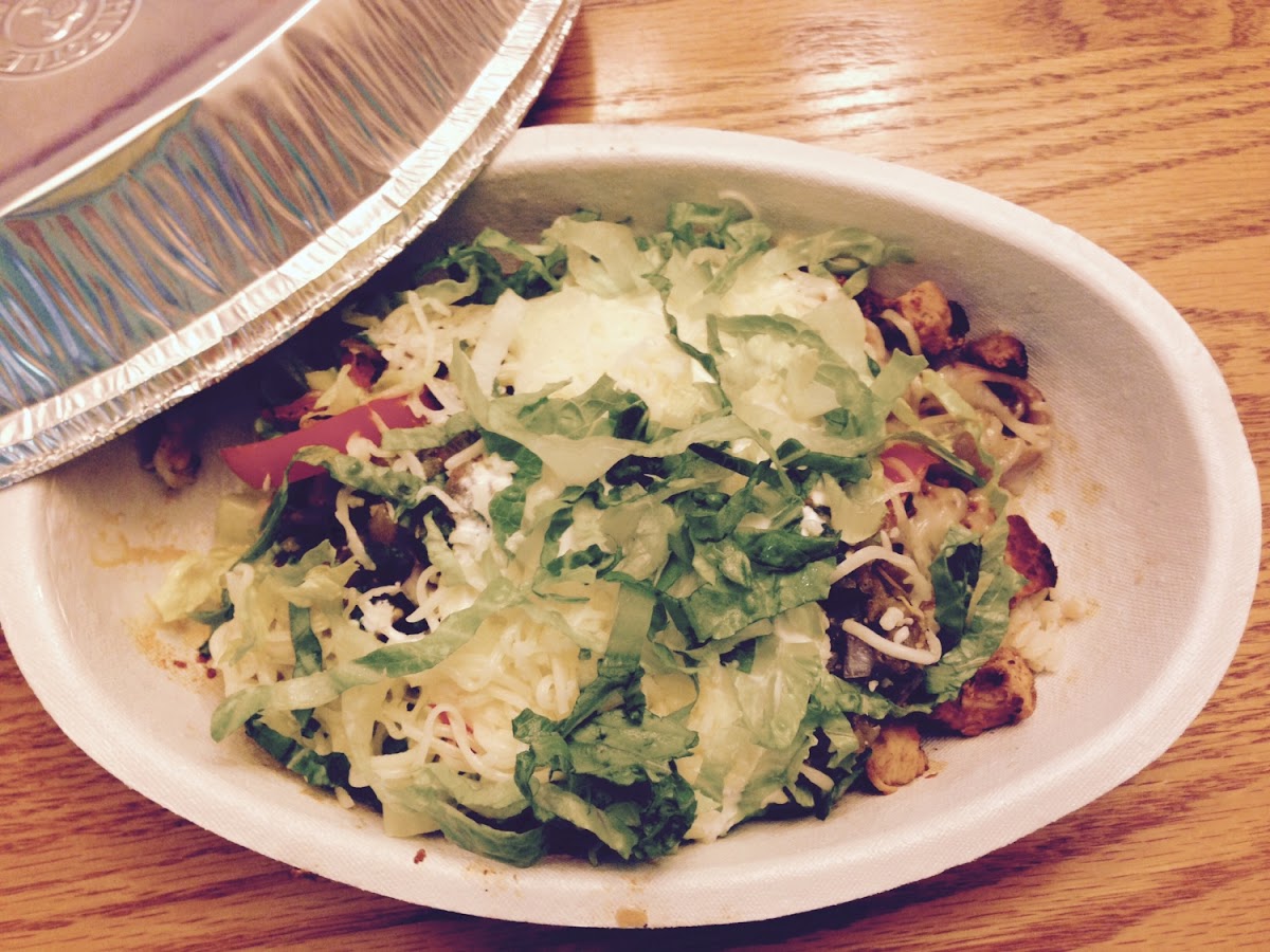 Rice Bowl with Chicken, Peppers, Salsa, Cheese, Sour Cream and Lettuce.