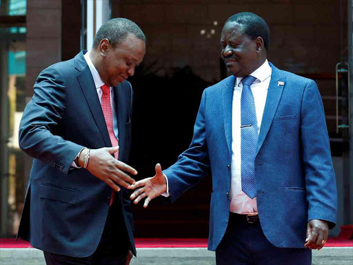 President Uhuru Kenyatta greets Opposition leader Raila Odinga of the National Super Alliance after addressing a news conference at Harambee House in Nairobi, March 9, 2018. /REUTERS