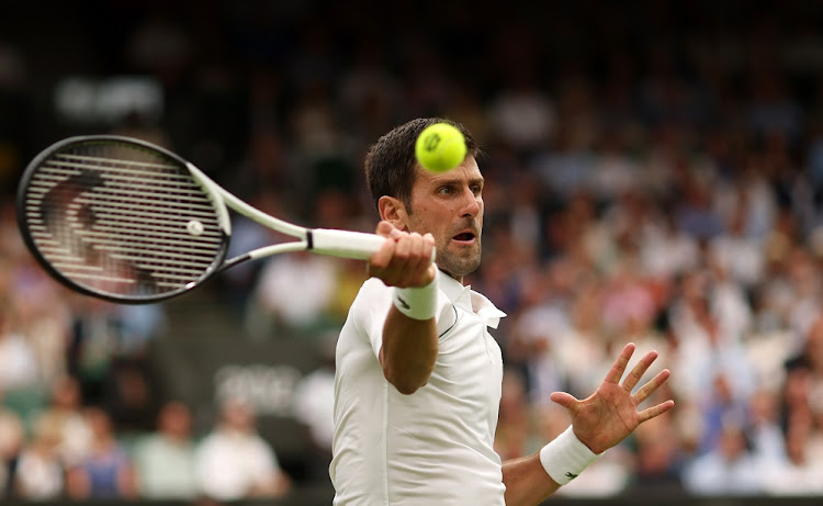 Novak Djokovic of Serbia plays a forehand against Soonwoo Kwon of South Korea in their first round match on day 1 of The Championships Wimbledon 2022 at the All England Lawn Tennis and Croquet Club in London on June 27 2022.