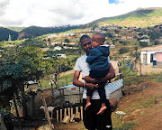 Thamsanqa Mkhize with his son Lisa at his rural 