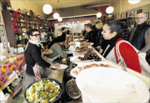 Karen Dudley, left, owner of The Kitchen, in Woodstock, where US first lady Michelle Obama took her family for lunch when she visited Cape Town last month Picture: ESA ALEXANDER