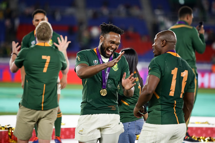 Lukhanyo Am and Mazakole Mapimpi of South Africa celebrates after the Rugby World Cup 2019 Final match between England and South Africa at International Stadium Yokohama on November 02, 2019 in Tokyo, Japan.