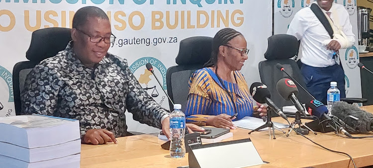 Gauteng Premier Panyaza receives the final report of the Usindiso building fire inquiry chaired by Judge Sisi Khampepe (right). While the cause of the fire was identified as arson, the commission of inquiry found the poor state of the premises led to a conflagration that destroyed the entire building.