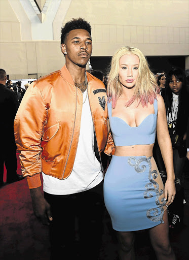 TOO FANCY FOR HER FACE? Basketballer Nick Young and Iggy Azalea at the Billboard Music Awards in Las Vegas
