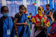 Healthcare workers wait to receive COVISHIELD, a Covid-19 vaccine manufactured by Serum Institute of India, during one of the world's largest Covid-19 vaccination campaigns at Mathalput Community Health Centre in Koraput district of the eastern state of Odisha, India, January 16, 2021. 