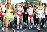 DOMINANT: Russians Oleys and Elena Nurgalieva during the Comrades Marathon between  Durban and Pietermaritzburg yesterday.  24/05/2009. Pic. Anesh Debiky.  © Gallo Imgaes
