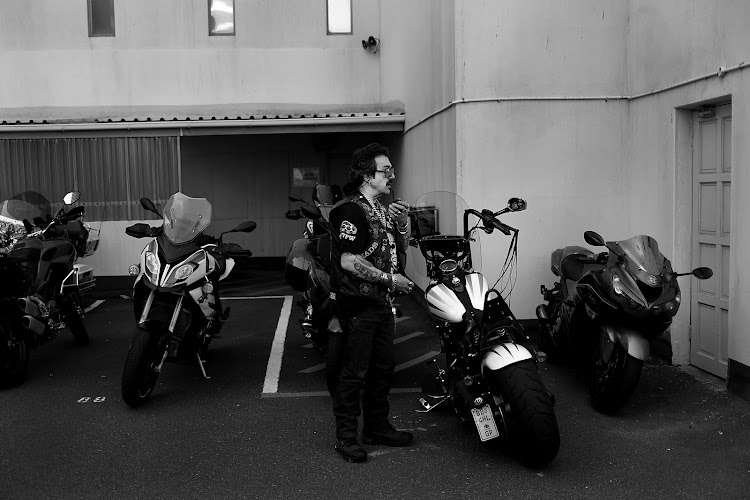 Cowboy, one of the original members of the Crusaders MC, gets ready to ride his bike.