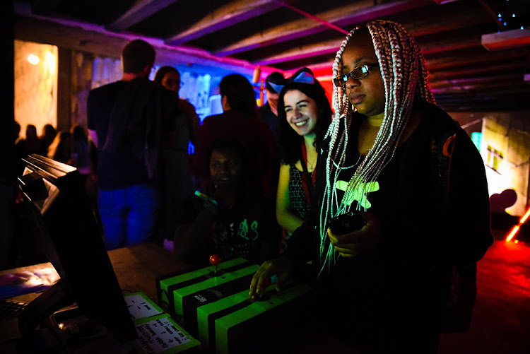 Sithe Ncube from Zambia plays one of the featured games on display at the A MAZE festival last year.