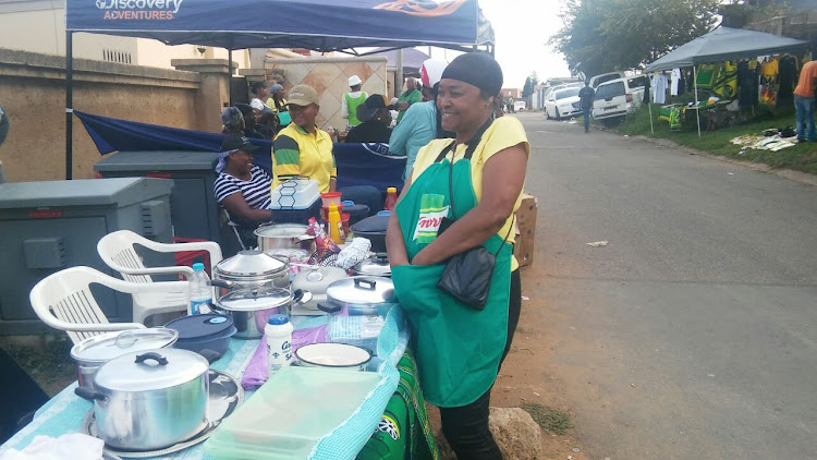 Sis Phindi selling food along Masedi Street in Orlando West, Soweto. This is the street where Mama Winnie' s home is. Entrepreneurs from the township have turned it into a street mall selling food and other items.