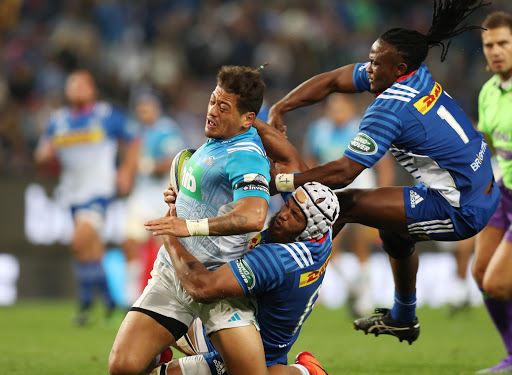 Augustine Pulu (L) of the Blues tackled by Nizaam Carr (c) and Seabelo Senatla (R) of the Stormers (r) during the 2017 Super Rugby match between at Newlands on 19 May 2017. Gavin Barker/BackpagePix