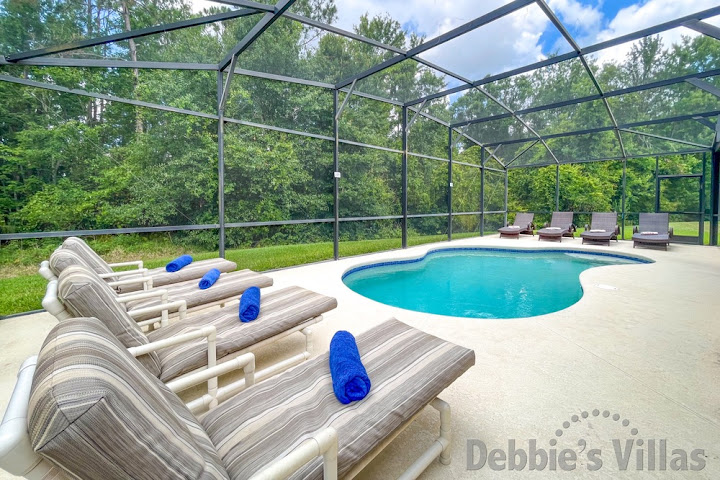 Admire the conservation views from the pool deck at this Davenport vacation villa