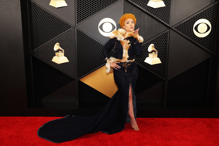 Ice Spice poses on the red carpet as she attends the 66th Annual Grammy Awards.