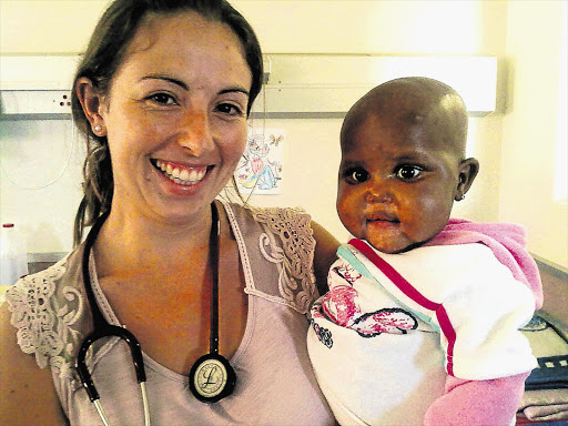EXTRA MILE: Dr Liz Gatley with a patient at Zithulele Hospital