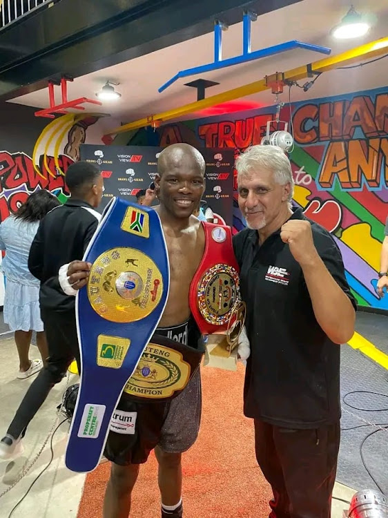 Newly crowned Boxing 5 Gauteng junior featherweight champ Vusi Ngcamu and trainer Alan Toweel Junior