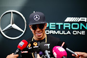 MONTMELO, SPAIN - MAY 07:  Lewis Hamilton of Great Britain and Mercedes GP speaks with members of the media in the paddock during previews to the Spanish Formula One Grand Prix at Circuit de Catalunya on May 7, 2015 in Montmelo, Spain.  (Photo by Paul Gilham/Getty Images)