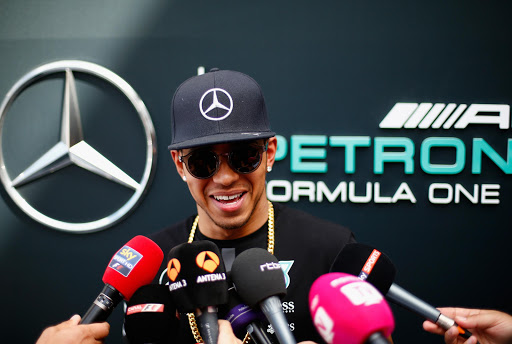 MONTMELO, SPAIN - MAY 07: Lewis Hamilton of Great Britain and Mercedes GP speaks with members of the media in the paddock during previews to the Spanish Formula One Grand Prix at Circuit de Catalunya on May 7, 2015 in Montmelo, Spain. (Photo by Paul Gilham/Getty Images)