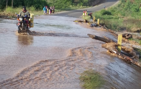 A motorcyclist navigates the flooded Malindi-Sala Gate Road at Madumadu village on Friday, May 3, 2024.