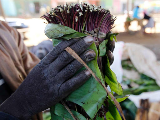 A khat farmer packs his crop at a collection point near his plantation in Maua, near Meru on August 20, 2014. Britain, whose large ethnic Somali community sustained a majority market for the leaves, banned khat as an illegal drug /REUTERS