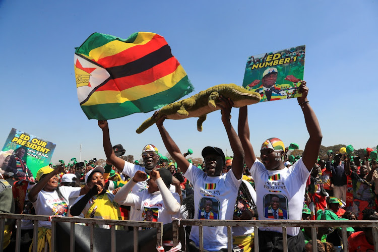 Supporters of Zimbabwe's President Emmerson Mnangagwa cheer at a rally before next week's general elections at Robert Gabriel Mugabe Square in Harare, Zimbabwe, on August 9 2023. Picture: PHILIMON BULAWAYO/REUTERS