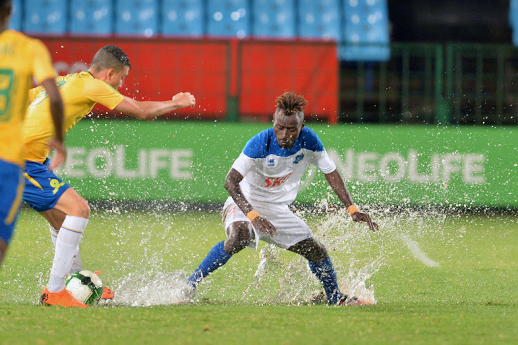 Ricardo Nascimento of Mamelodi Sundowns and Christ Mbondi of Rayon Sports during the CAF Champions League match between Mamelodi Sundowns and Rayon Sports at Loftus Stadium