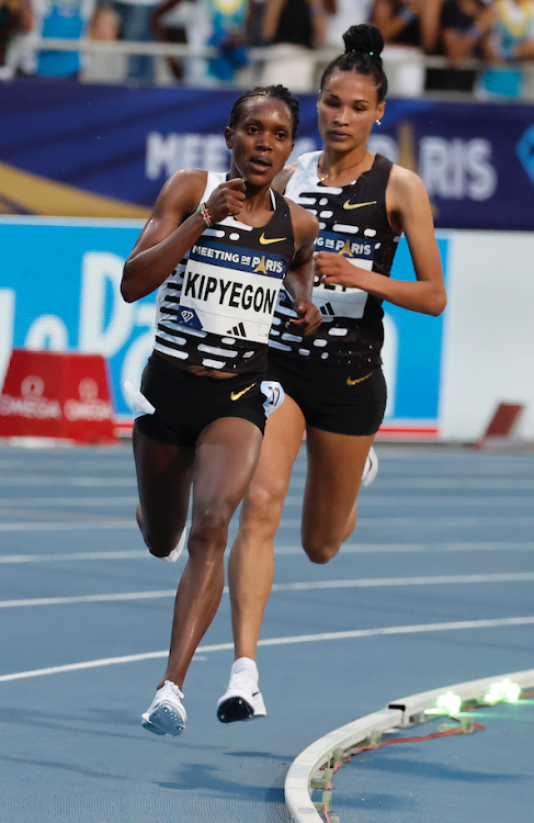 Faith Kipyegon and Letesenbet Gidey of Ethiopia compete during the women's 5000m final at the Diamond League Athletics meeting of Paris in France on June 9, 2023.