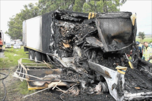 FIERY DEATH: Mpumalanga police said 18 people died when a truck and a taxi travelling from Mozambique to Joburg collided on the N4 in Belfast, yesterday. PHOTO: JOSEPH MABUZA