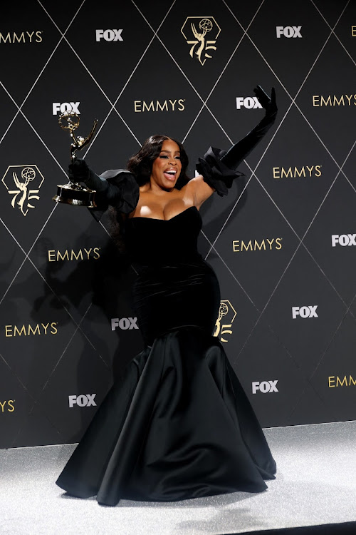 Niecy Nash-Betts poses with the Supporting Actress in a Limited/Anthology Series or Movie award.