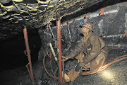 A miner drilling