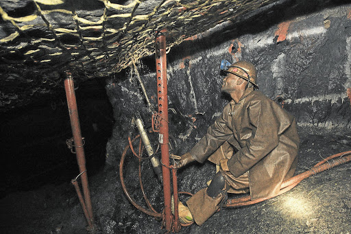 A miner drilling