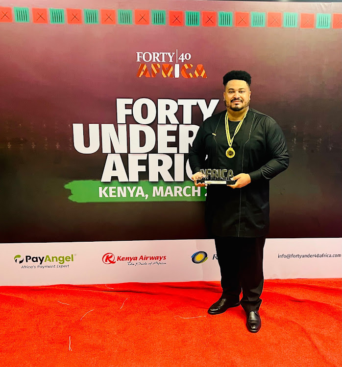 Modern Floors CEO Basil David Anthony displays his awards at the Forty Under 40 Africa Awards