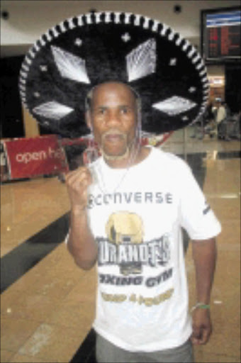 Simphiwe Nongqayi. Pic. Bafana Mahlangu. 20/09/2009. © Sowetan. 2009920 BMA Simphiwe Nongqayi from Border Post in the Eastern Cape arrived at the OR Tambo International airport after winning the IBF junior bantamweight title on a unanimous points decision against Jorge "Travieso Arce. The bout was held at the Plaza de Toros in Cancum, Mexico on 15.09.2009. PHOTO: BAFANA MAHLANGU