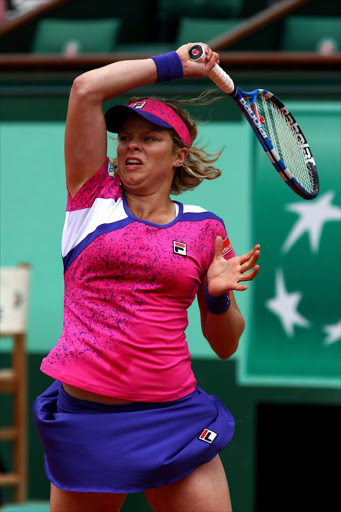 Kim Clijsters of Belgium hits a forehand during the women's singles round two match between Arantxa Rus of Netherlands and Kim Clijsters of Belgium on day five of the French Open at Roland Garros on May 26, 2011 in Paris, France