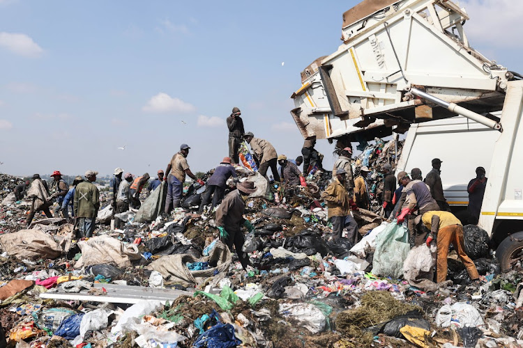 Waste reclaimers at the Simmer and Jack landfill site in Primrose, south of Germiston. On Tuesday zama zamas near the site were embroiled in a gun battle with police. Picture: ALAISTER RUSSELL/FILE