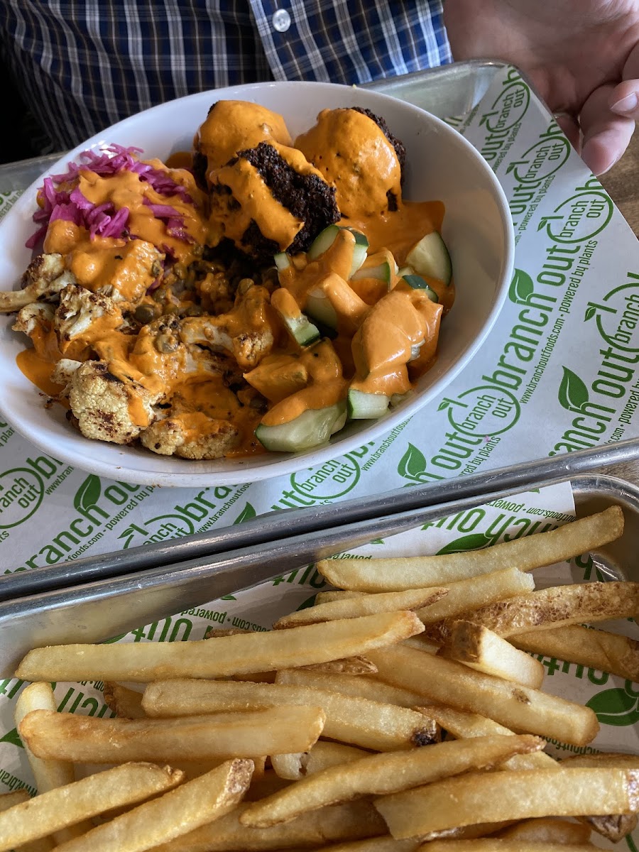 Falafel bowl drizzled in roasted red pepper sauce.