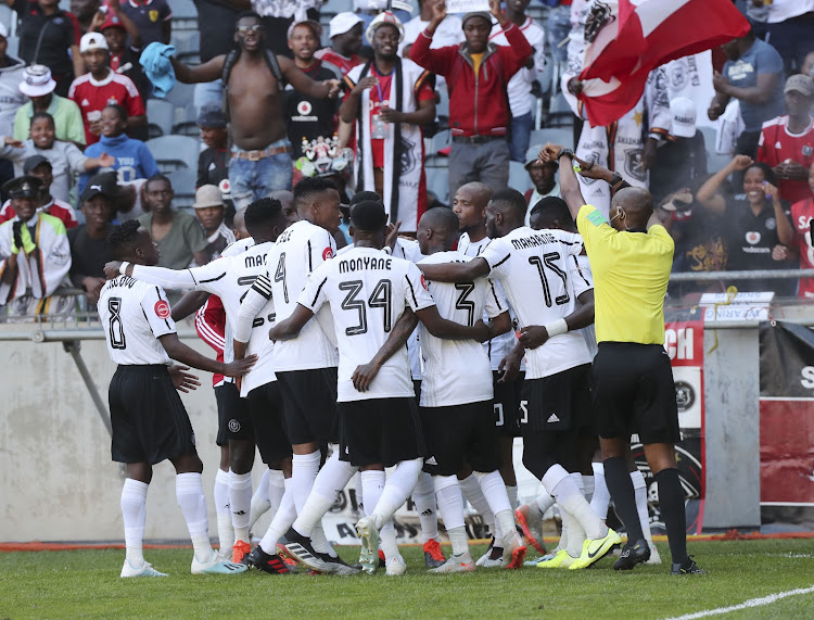 Tshegofatso Mabasa celebrates with teammates after scoring his second goal.