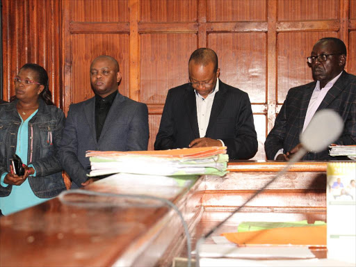 Businessman Ben Gethi, former National Youth Service director Nelson Githinji and former Devolution PS Peter Mangiti at the Milimani law courts during the hearing of their case yesterday /PHILIP KAMAKYA