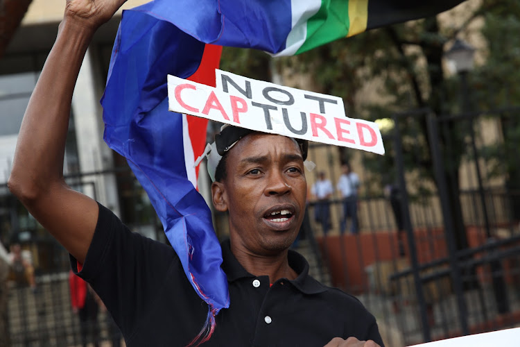 Protester chants outside the Bloemfontein Magistrates Court where the Estina dairy farm accused appear on fraud and money laundering charges. 15 February 2018.