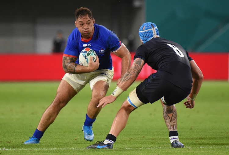 KOBE, JAPAN - SEPTEMBER 30: Chris Vui of Samoa advances with the ball while Blade Thomson of Scotland is about to tackle during the Rugby World Cup 2019 Group A game between Scotland and Samoa at Kobe Misaki Stadium on September 30, 2019 in Kobe, Hyogo, Japan. Picture: KAZ PHOTOGRAPHY / GETTY IMAGES