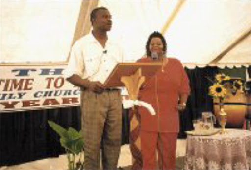 SOUL-SEARCHING: Pastor Isaac Mokgope preaches in his church in Rustenburg. Next to him is his wife Messina. Pic. Unknown.