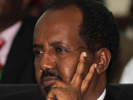 Somalia President Hassan Sheikh Mohamud listens to proceedings after winning the election in Mogadishu, September 10, 2012. /REUTERS