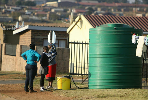 People wait to get water from a container brought to Silobela township in Carolina, as the municipality's water found to be unsuitable to drink, May 2020. Picture: SOWETAN