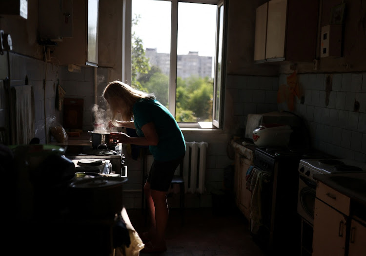 Natalia Pokutna, 58, a visually impaired person cooks in the community kitchen of a hostel for the blind, amid Russia's invasion of Ukraine, in Kharkiv, Ukraine. REUTERS/NACHO DOCE