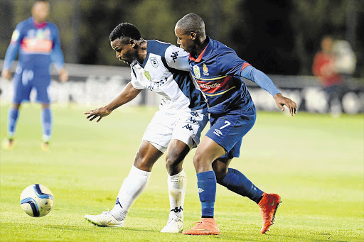 IT'S MY BALL, SON: Bidvest Wits' veteran striker, Chris Katongo, protects the ball against young midfielder Siyabonga Ngubane of the University of Pretoria during their sides' Nedbank Cup last-16 match at Bidvest Stadium last night