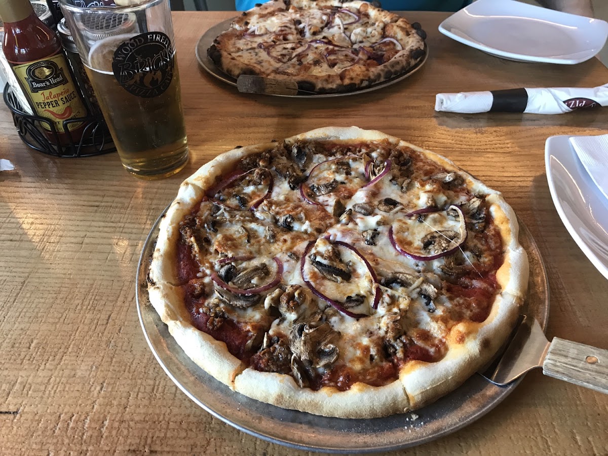 My gf 'The Bricks', a Peroni (beer), and a regular BBQ Chicken pizza in the background, for comparison.