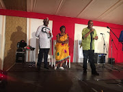 Advocate Dali Mpofu giving a speech with Floyd Shivambu and his bride in the background. Picture: EFF twitter @EFFSouthAfrica